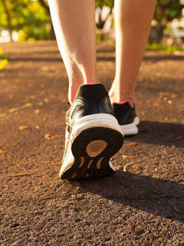 Close up woman walking on a path. Fitness concept.